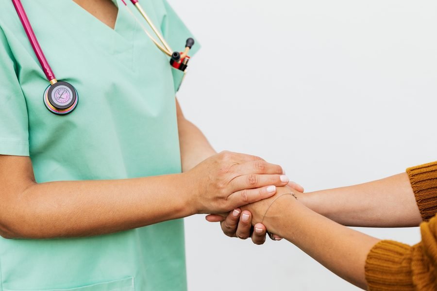 A nurse with a smiling donor